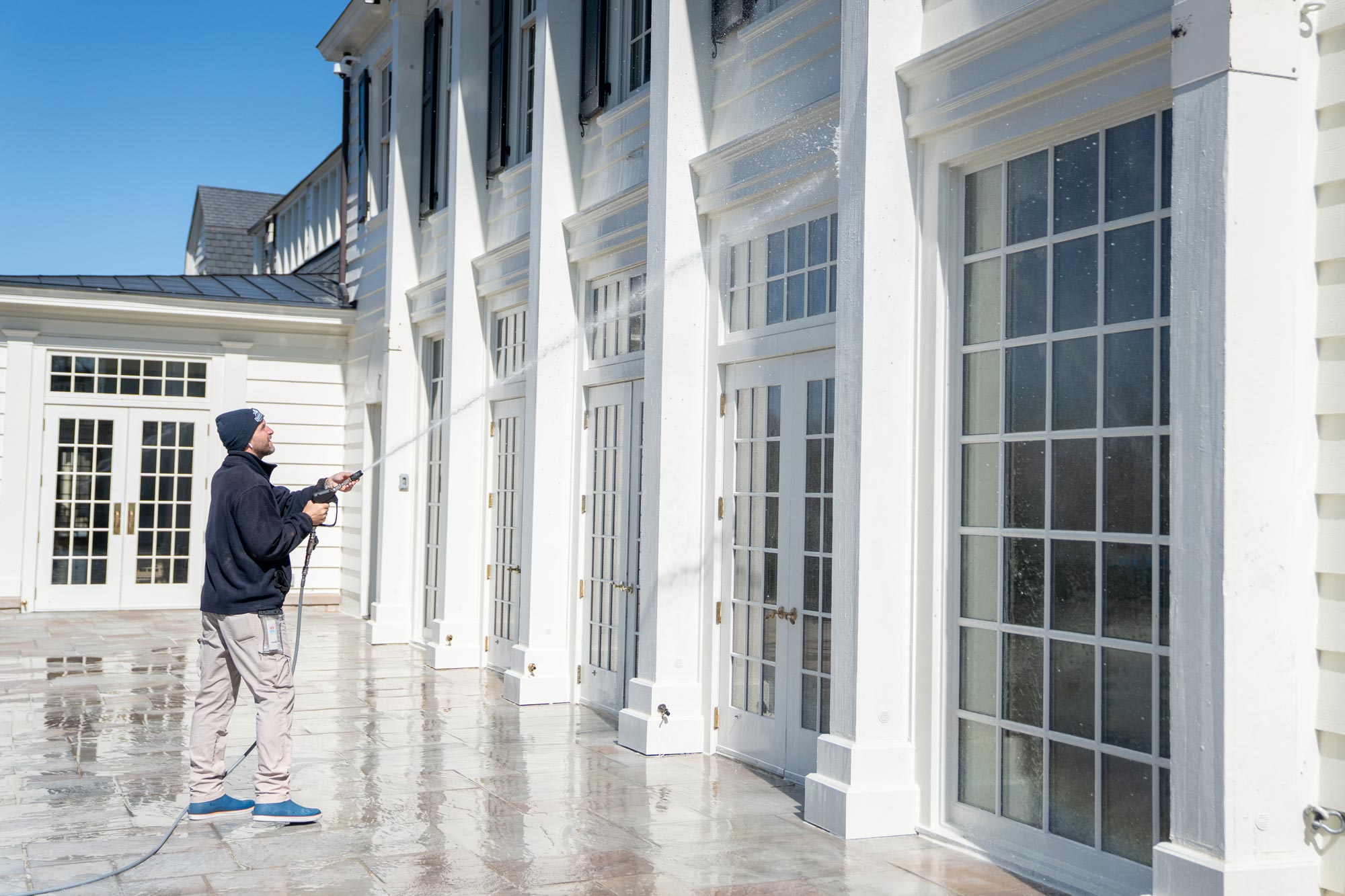Power washing a home exterior